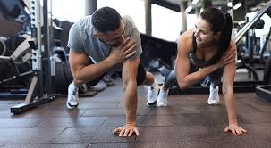 Toning Bingo Wings: Your Ultimate Guide to Sculpting Sleek Arms at the Gym 3 Fitness trainer demonstrating arm toning exercises Hatfield