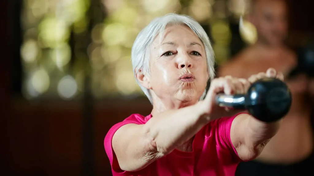Toning Bingo Wings: Effective Exercises and Tips for Achieving Sleeker Arms 2 Person performing arm exercises with dumbbells Hatfield