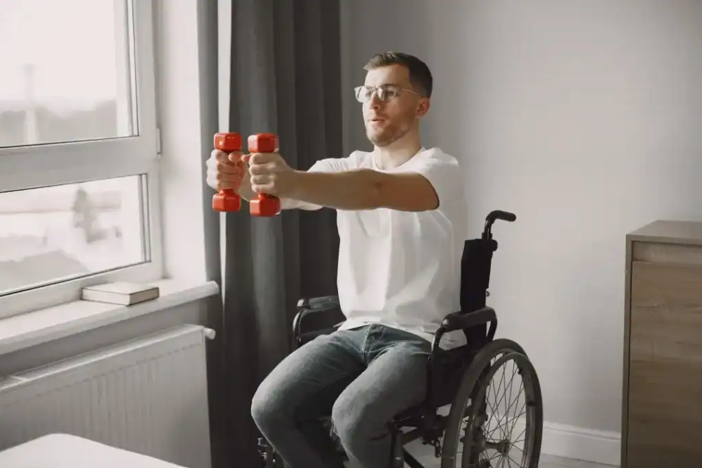 Empowering Weight Loss: A Comprehensive Guide for Individuals with Disabilities 1 Image of man doing exercise in his wheelchair to aid weight loss Hatfield